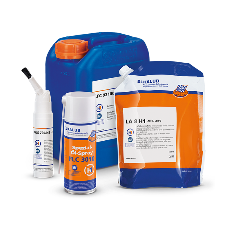 A composition of various ELKALUB containers. Shown are a white brush can with ELKALUB GLS 794/N2, a can of special oil spray FLC 3010, a tubular bag with LA 8 H1 and a blue 5-liter can of ELKALUB LFC 92100.